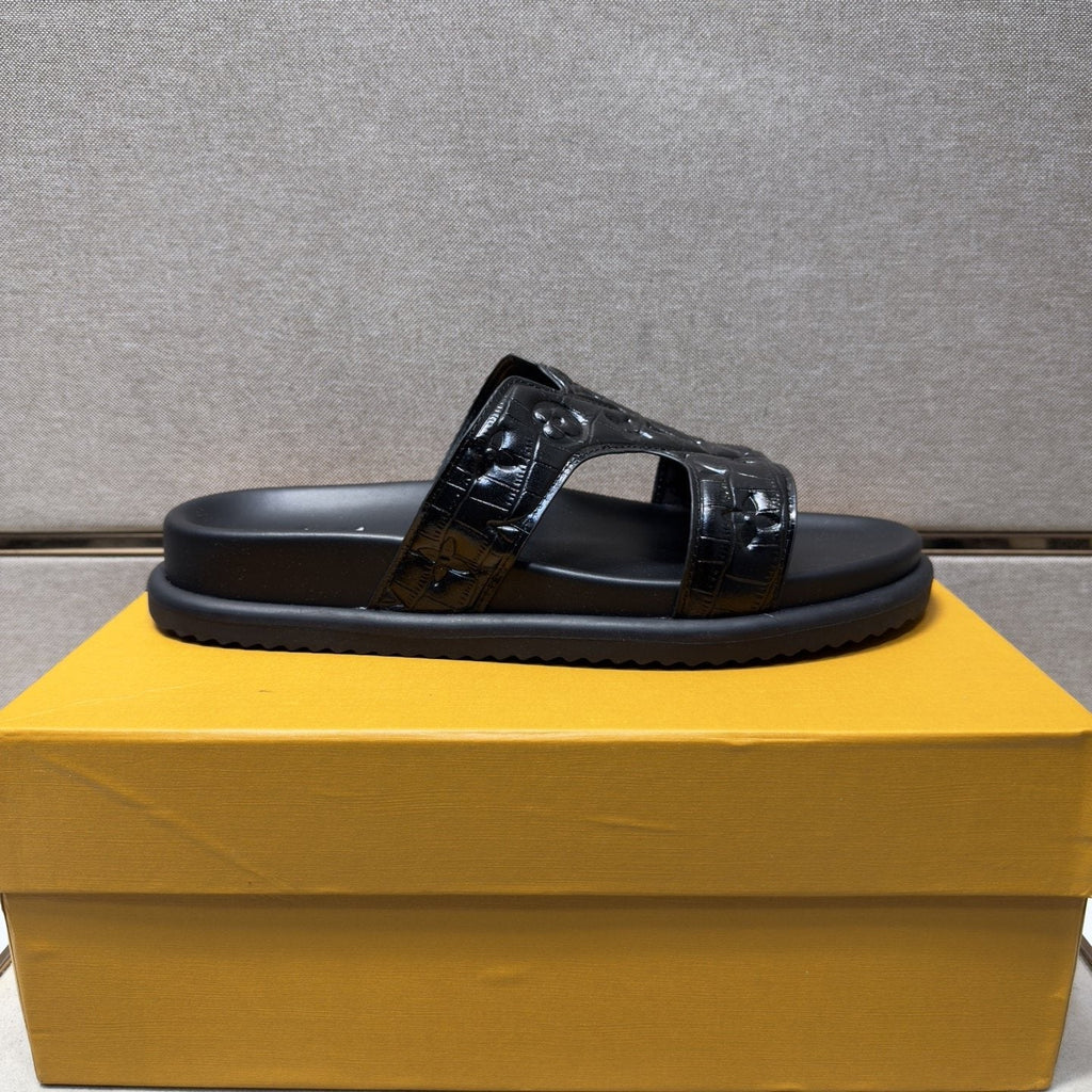 Louis Vuitton Textured Monogram Slide Sandals — front