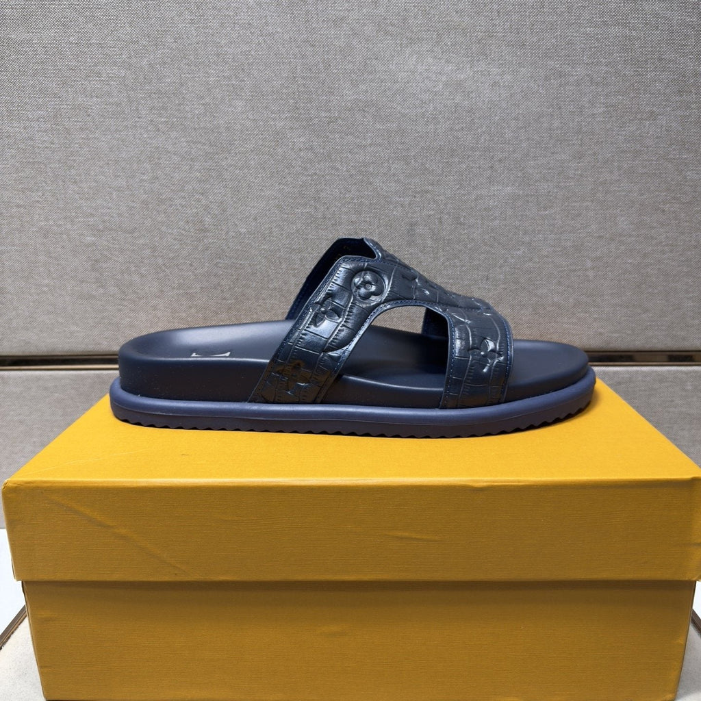 Louis Vuitton Textured Monogram Slide Sandals — side
