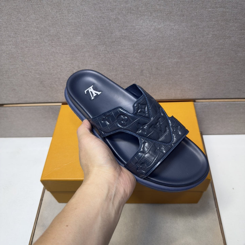 Louis Vuitton Textured Monogram Slide Sandals — model